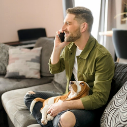 Man at home after rehab is talking on a phone