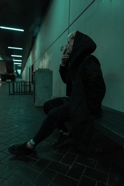 Young man addicted to meth sitting in a tunel 