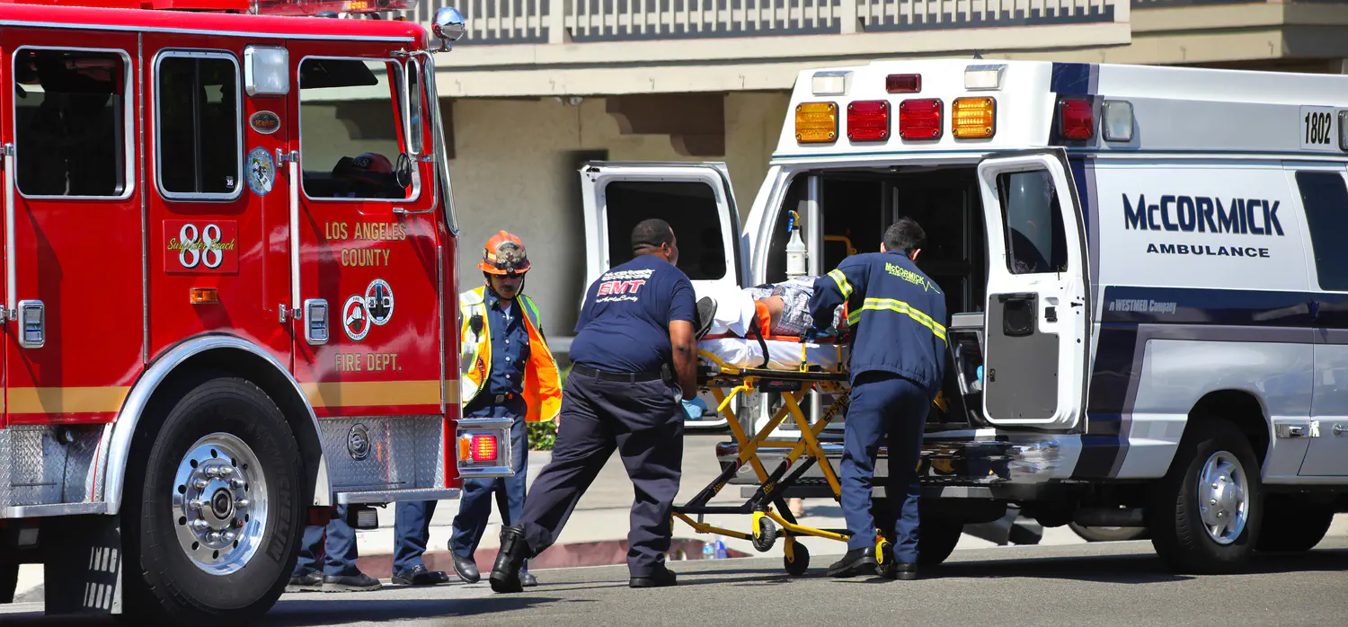 LA County Fire Department and Paramedics loading an ambulance