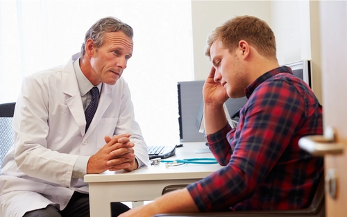 Doctor speaking sternly to patient