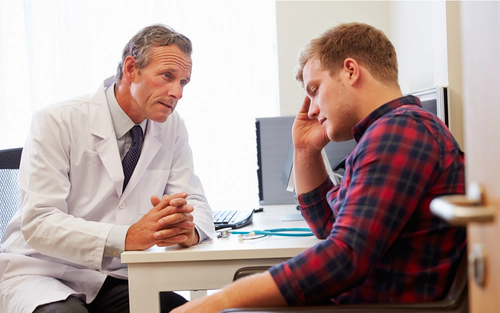 Doctor speaking sternly to patient