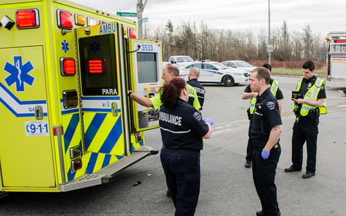 Paramedics in front of an ambulance